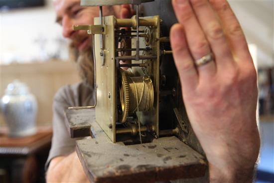 George Hewett of Marlborough. A George III oak eight day longcase clock, H.7ft 9in.